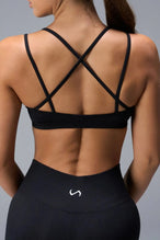 Back View of Black TLF Cosmic Seamless Strappy Sports, featuring medium impact support and a strappy back design 