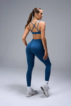 Back View of Blue TLF Cosmic Seamless Scrunch Butt Leggings, featuring a scrunch butt to shape and contour your glutes 