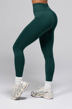 Side View of Cosmic Seamless Scrunch Butt Leggings in Deep Harvest Green 