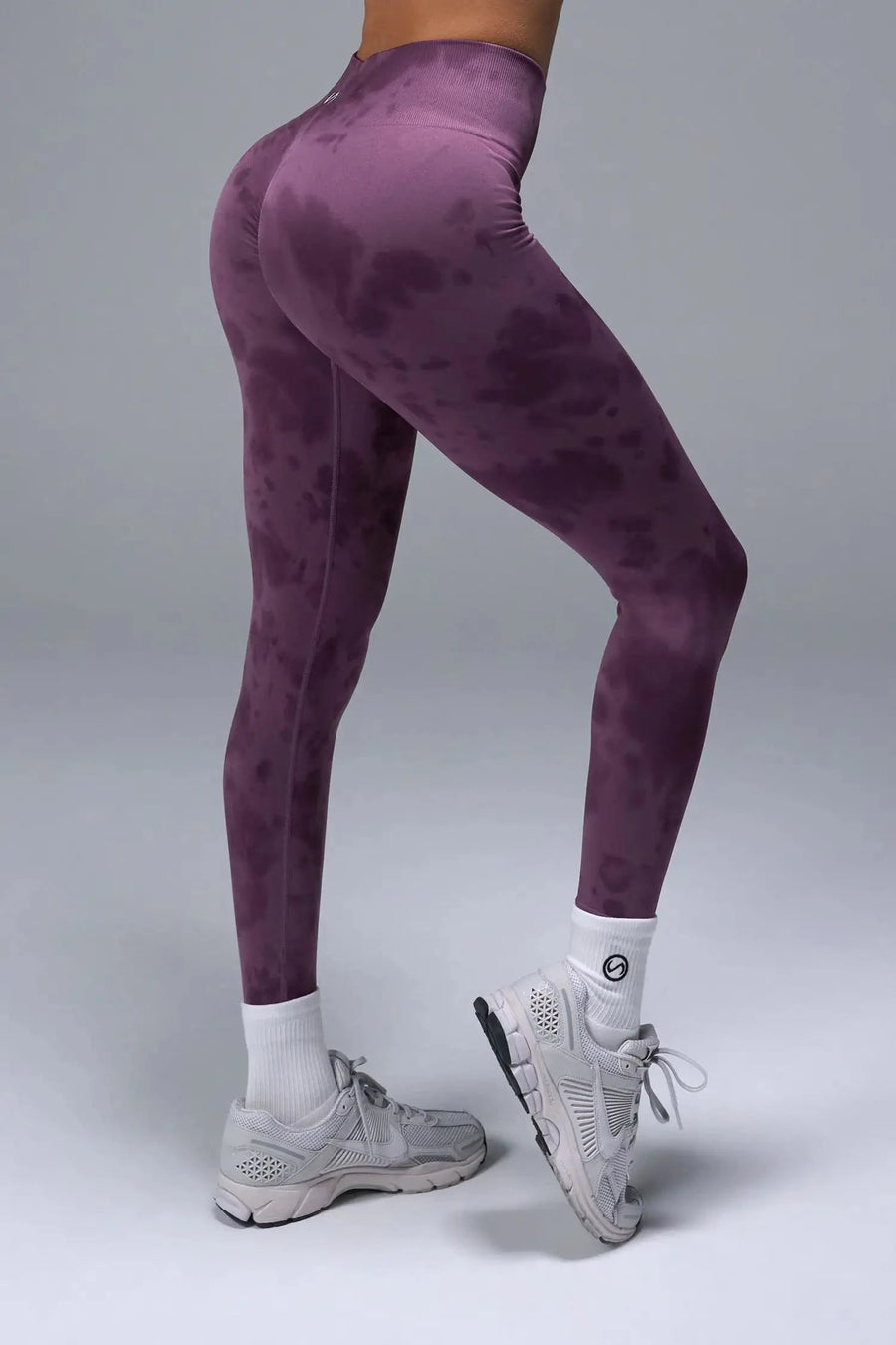 Side View of Purple TLF Cosmic Seamless Scrunch Butt Leggings, featuring a scrunch butt to shape and contour your glutes 