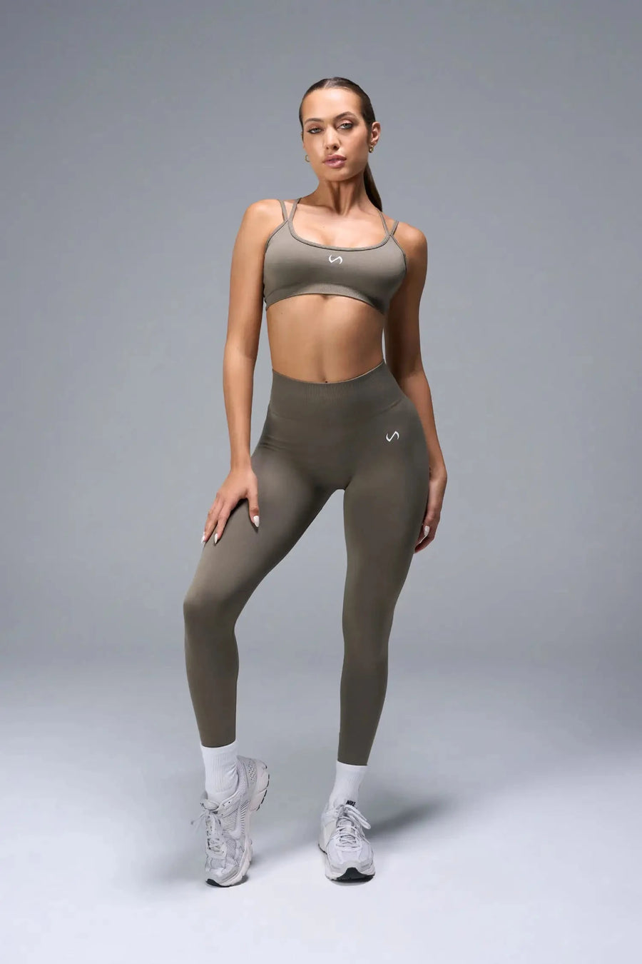 Front View of Brown TLF Cosmic Seamless Scrunch Butt Leggings, featuring a scrunch butt to shape and contour your glutes 