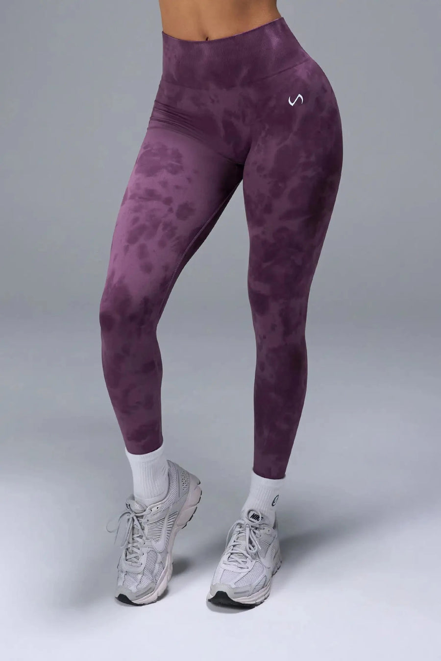 Front View of Purple TLF Cosmic Seamless Scrunch Butt Leggings, featuring a scrunch butt to shape and contour your glutes 