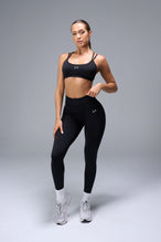 Front View of Black TLF Cosmic Seamless Scrunch Butt Leggings, featuring a scrunch butt to shape and contour your glutes 