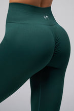 Back View of Cosmic Seamless Scrunch Butt Leggings in Deep Harvest Green 