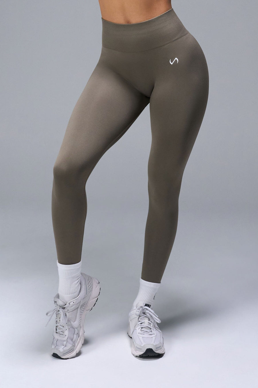 Back View of Brown TLF Cosmic Seamless Scrunch Butt Leggings, featuring a scrunch butt to shape and contour your glutes 