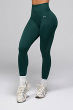 Front View of Cosmic Seamless Scrunch Butt Leggings in Deep Harvest Green 