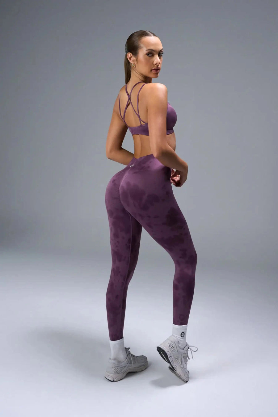 Side View of Purple TLF Cosmic Seamless Scrunch Butt Leggings, featuring a scrunch butt to shape and contour your glutes 