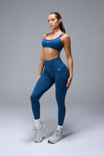 Front View of Blue TLF Cosmic Seamless Scrunch Butt Leggings, featuring a scrunch butt to shape and contour your glutes 