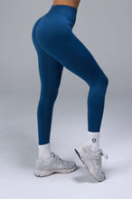 Back View of Blue TLF Cosmic Seamless Scrunch Butt Leggings, featuring a scrunch butt to shape and contour your glutes 
