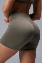 Back View of Brown TLF Cosmic Seamless Scrunch Butt Shorts, featuring a scrunch butt to shape and contour your glutes