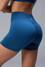 Back View of Blue TLF Cosmic Seamless Scrunch Butt Shorts, featuring a scrunch butt to shape and contour your glutes 