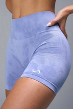 Side View of Blue TLF Cosmic Seamless Scrunch Butt Shorts, featuring a scrunch butt to shape and contour your glutes 