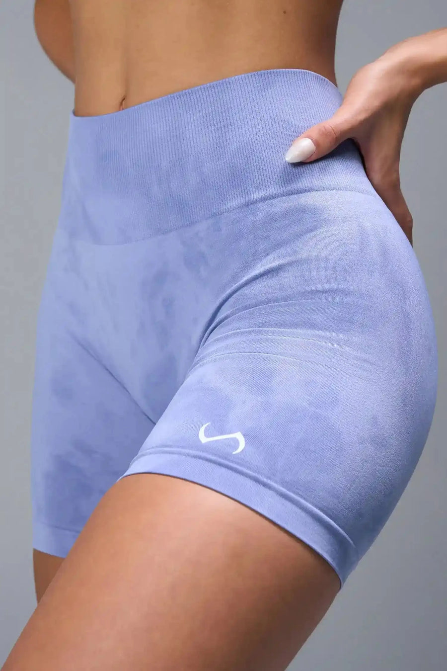 Side View of Blue TLF Cosmic Seamless Scrunch Butt Shorts, featuring a scrunch butt to shape and contour your glutes 