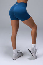Back View of Blue TLF Cosmic Seamless Scrunch Butt Shorts, featuring a scrunch butt to shape and contour your glutes