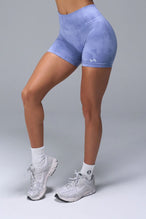 Side View of Blue TLF Cosmic Seamless Scrunch Butt Shorts, featuring a scrunch butt to shape and contour your glutes 