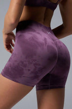 Side View of Purple TLF Cosmic Seamless Scrunch Butt Shorts, featuring a scrunch butt to shape and contour your glutes 