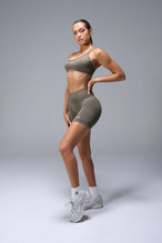 Front View of Brown TLF Cosmic Seamless Scrunch Butt Shorts, featuring a scrunch butt to shape and contour your glutes 