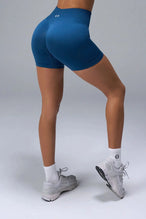 Back View of Blue TLF Cosmic Seamless Scrunch Butt Shorts, featuring a scrunch butt to shape and contour your glutes 