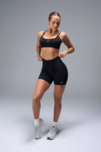 Front View of Black TLF Cosmic Seamless Scrunch Butt Shorts, featuring a scrunch butt to shape and contour your glutes 