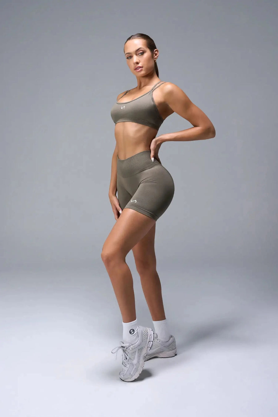 Side View of Brown TLF Cosmic Seamless Scrunch Butt Shorts, featuring a scrunch butt to shape and contour your glutes 