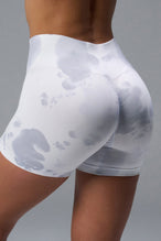 Back View of White TLF Cosmic Seamless Scrunch Butt Shorts, featuring a scrunch butt to shape and contour your glutes 