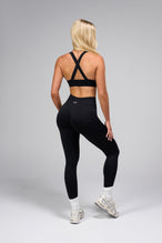 Side View Of Cosmic Seamless Square Neck Sports Bra in Black