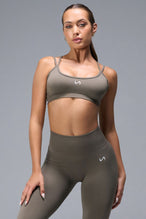 Front View of Brown TLF Cosmic Seamless Strappy Sports, featuring medium impact support and a strappy back design 