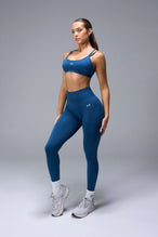 Front View of Blue TLF Cosmic Seamless Strappy Sports, featuring medium impact support and a strappy back design 
