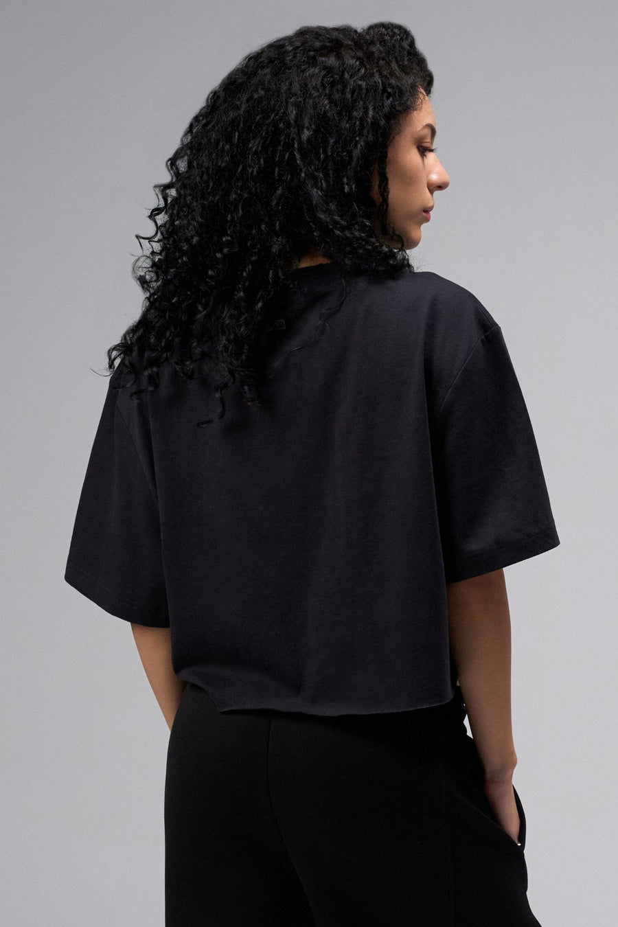 Back view Of Women's Dura Cotton Oversized Cropped Tee in Black