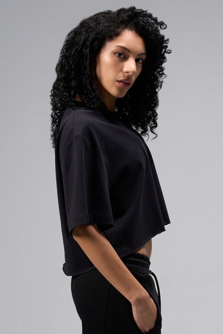 Side view Of Women's Dura Cotton Oversized Cropped Tee in Black