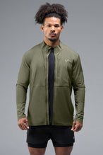 Front View of Green TLF Element Athletic Jacket, featuring multiple zipper pockets, and ripstop panels for breathability and stretch 