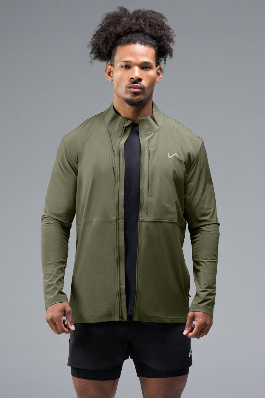 Front View of Green TLF Element Athletic Jacket, featuring multiple zipper pockets, and ripstop panels for breathability and stretch 
