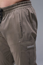 Detail Front View of Brown TLF Element Athletic Joggers 2.0, featuring side zipper pockets and side leg cargo pockets and reflective details 