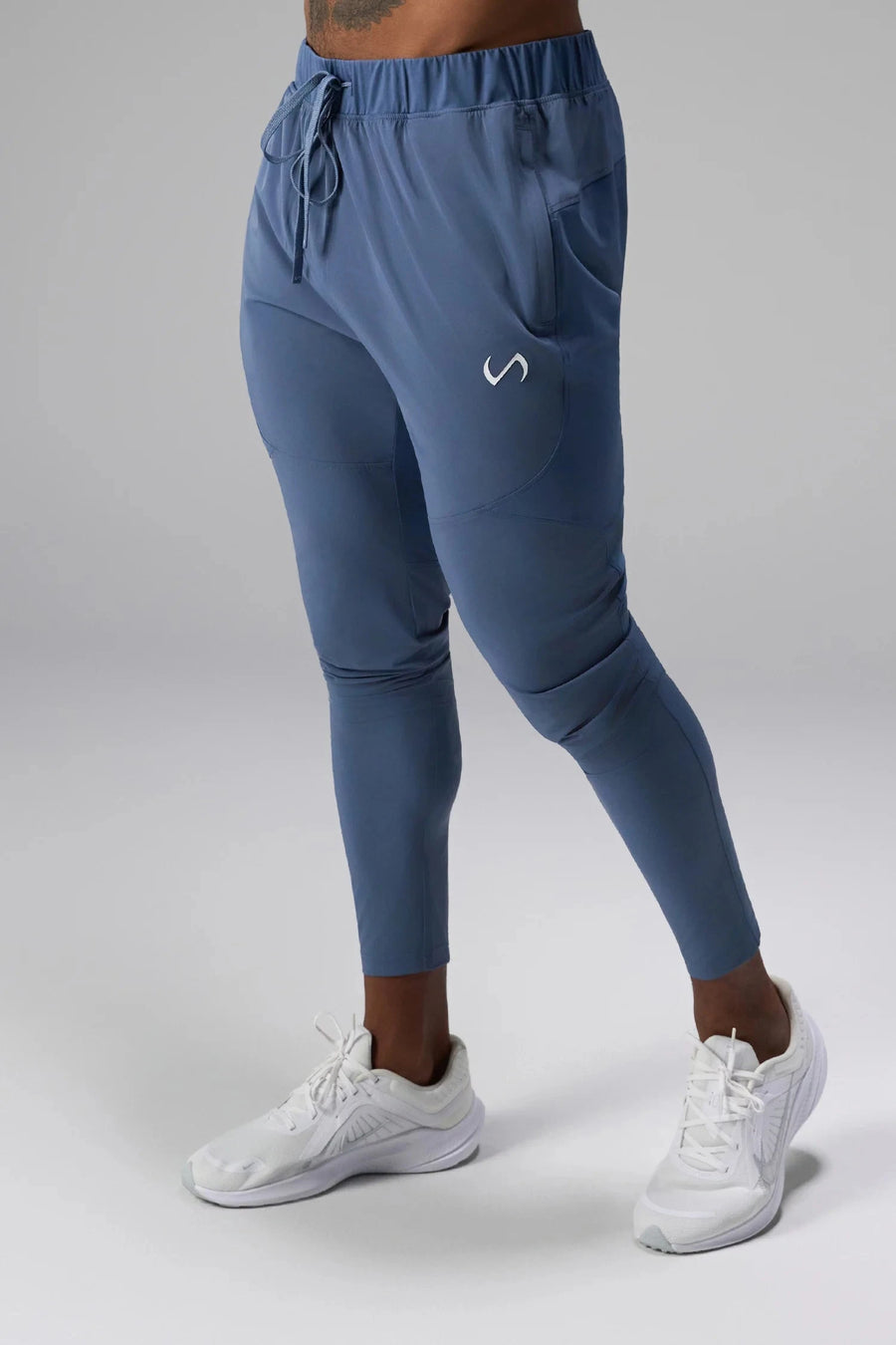 Front View of Blue the TLF Element Infi-Dry Hybrid Joggers featuring side zipper pockets, zippered ankles and drawcord waistband for a custom fit.