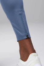 Detail View of Blue the TLF Element Infi-Dry Hybrid Joggers featuring side zipper pockets, zippered ankles and drawcord waistband for a custom fit.