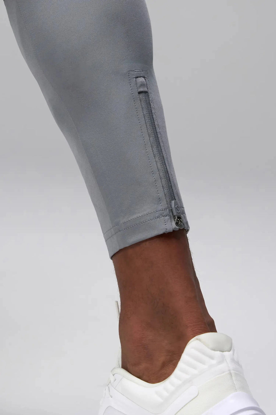 Detail View of Gray the TLF Element Infi-Dry Hybrid Joggers featuring side zipper pockets, zippered ankles and drawcord waistband for a custom fit. 