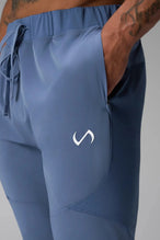 Front View of Blue the TLF Element Infi-Dry Hybrid Joggers featuring side zipper pockets, zippered ankles and drawcord waistband for a custom fit.