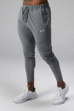 Front View of Gray the TLF Element Infi-Dry Hybrid Joggers featuring side zipper pockets, zippered ankles and drawcord waistband for a custom fit. 