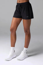 Front View of the Black the TLF Element Infi Dry Shorts With Liner featuring built in shorts with pockets and high side slit for mobility
