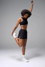 Front View of the Black the TLF Element Infi Dry Shorts With Liner featuring built in shorts with pockets and high side slit for mobility