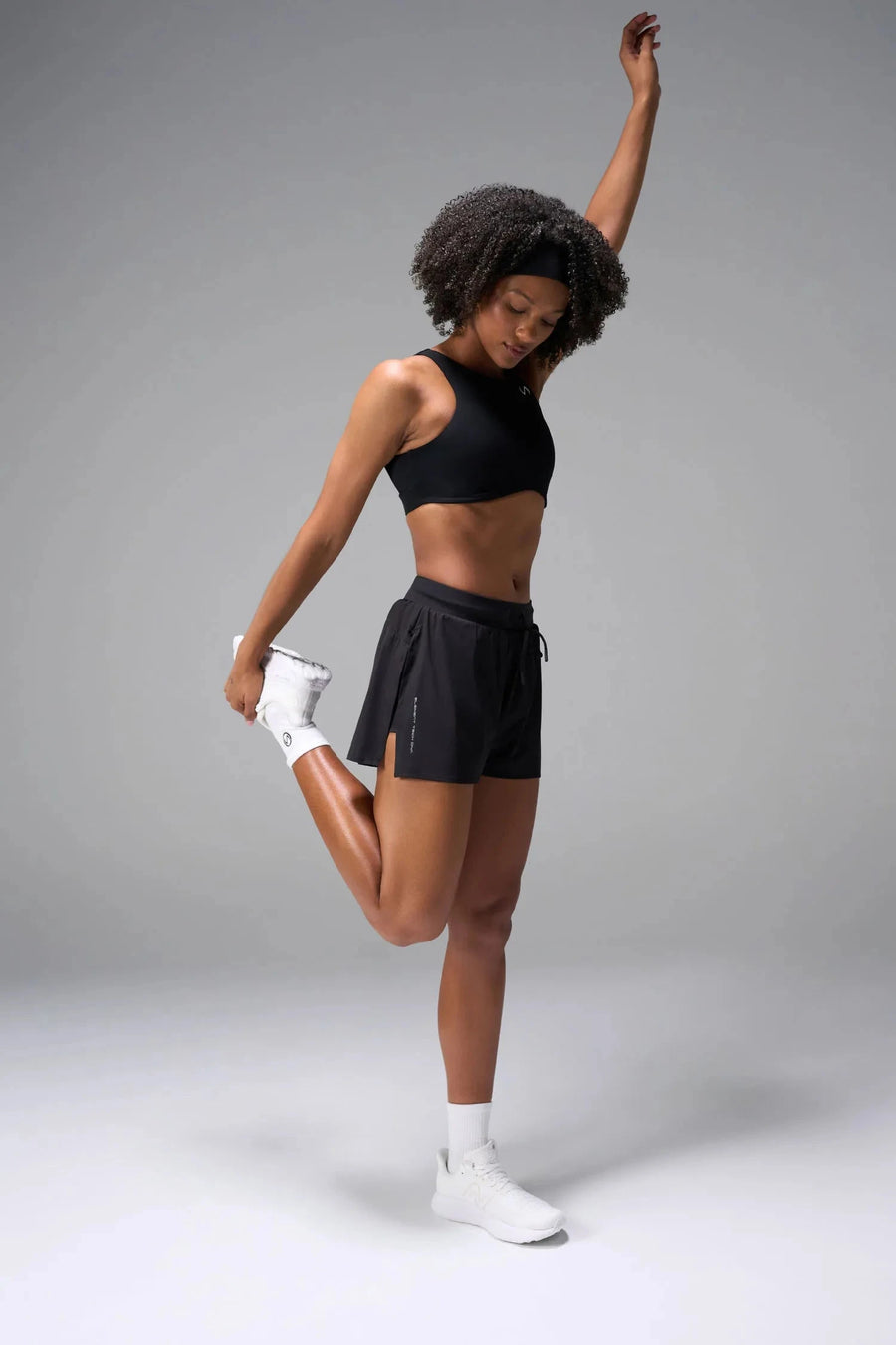 Front View of the Black the TLF Element Infi Dry Shorts With Liner featuring built in shorts with pockets and high side slit for mobility