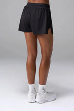 Back View of the Black the TLF Element Infi Dry Shorts With Liner featuring built in shorts with pockets and high side slit for mobility