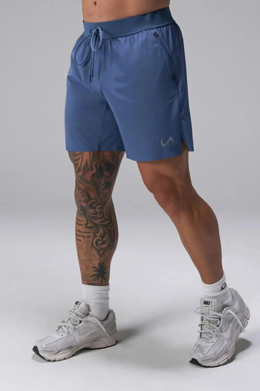 Front View of the Blue the TLF Element Light 7 Inch Shorts featuring side zipper pockets, side split hems and reflective details for nighttime visibility. 