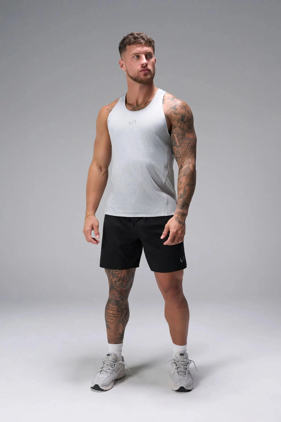 Front View of the Black the TLF Element Light 7 Inch Shorts featuring side zipper pockets, side split hems and reflective details for nighttime visibility