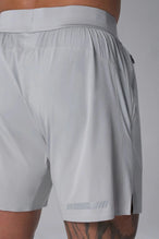 Back View of the Gray the TLF Element Light 7 Inch Shorts featuring side zipper pockets, side split hems and reflective details for nighttime visibility. 