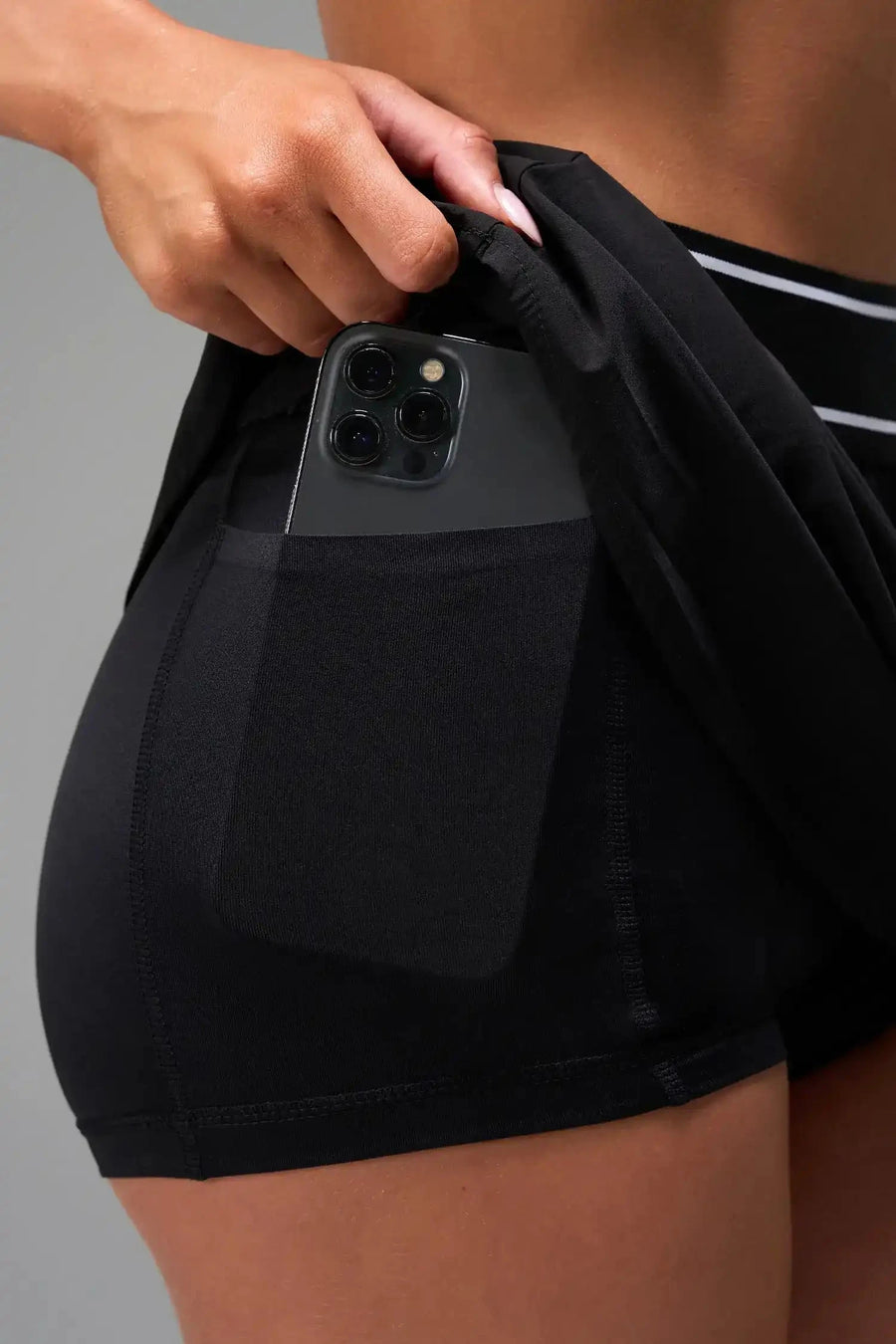 Front Detail View of Black TLF Element workout skirt featuring built in 2.5-inch inseam shorts and side pockets