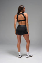 Back View of Black TLF Element workout skirt featuring built in 2.5-inch inseam shorts and side pockets