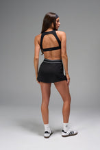 Back View of Black TLF Element workout skirt featuring built in 2.5-inch inseam shorts and side pockets
