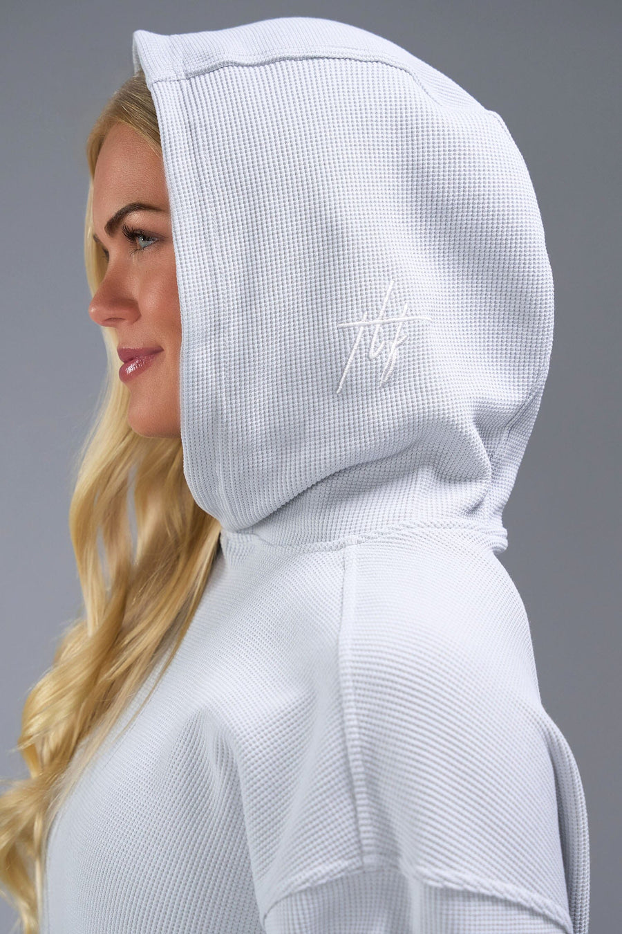 Detail Side View of Gray TLF Elevate Waffle Tech Hoodie, featuring kangaroo pockets, and double panel hoodie designed for all day wear 