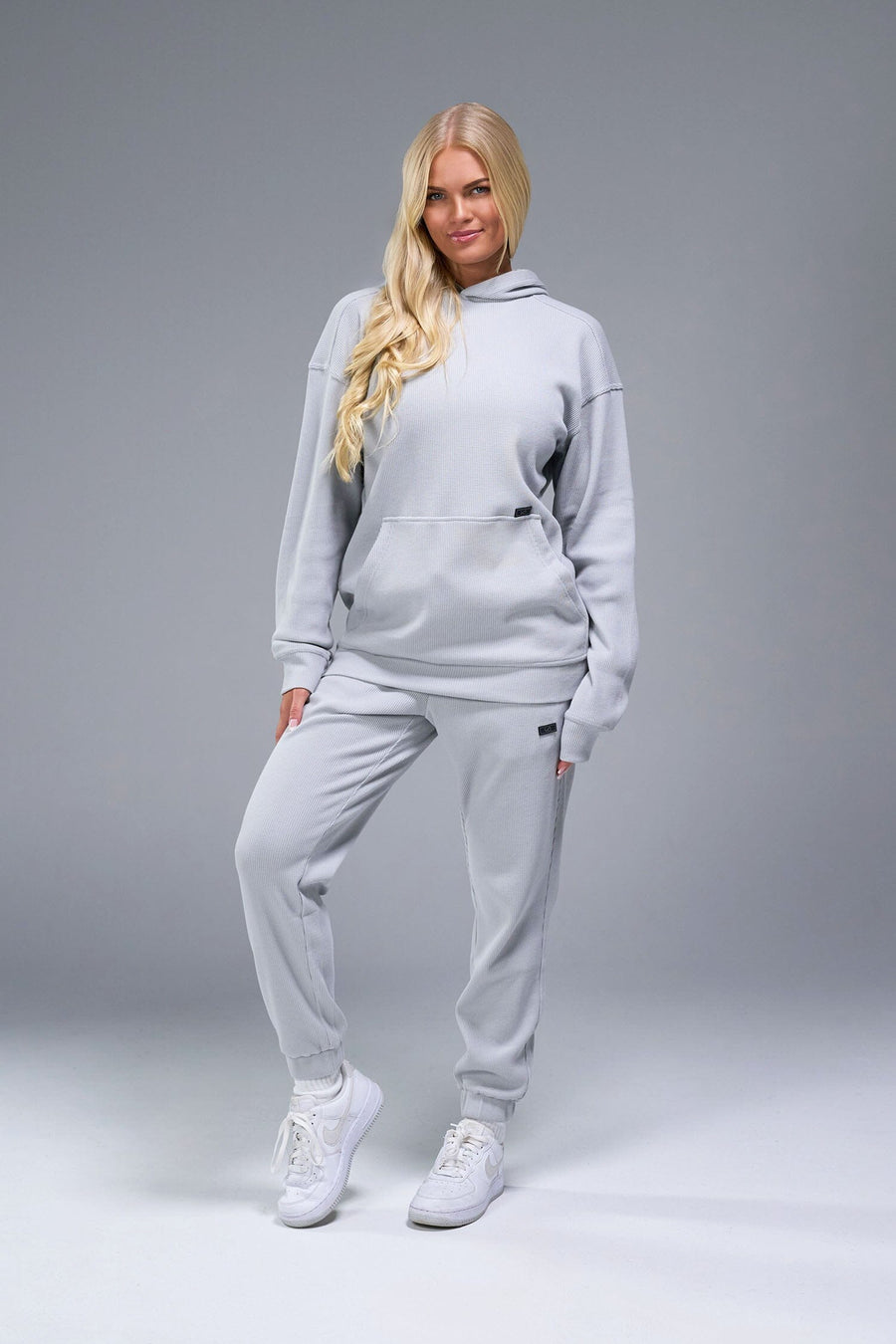 Front View of Gray TLF Elevate Waffle Tech Hoodie, featuring kangaroo pockets, and double panel hoodie designed for all day wear 